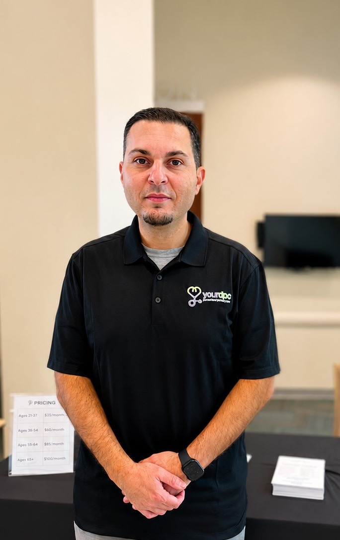 Dr. Hasan Suleiman, board-certified family medicine physician, at the yourDPC info table in New Tampa